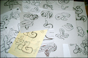 Pencil sketches of snakes.
